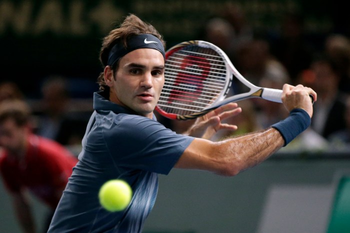 Federer of Switzerland hits return to Djokovic of Serbia in their semi-final match of the Paris Masters tennis tournament in Paris